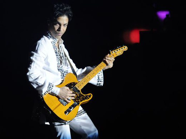 Prince performs during his headlining set at Coachella Valley Music and Arts Festival..