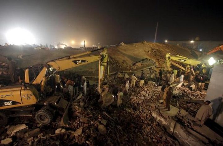 Rescue workers search for survivors after a factory collapsed near the eastern city of Lahore