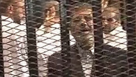 Mohamed Morsi Trial Adjourned as Chaos Breaks out in Egyptian Court