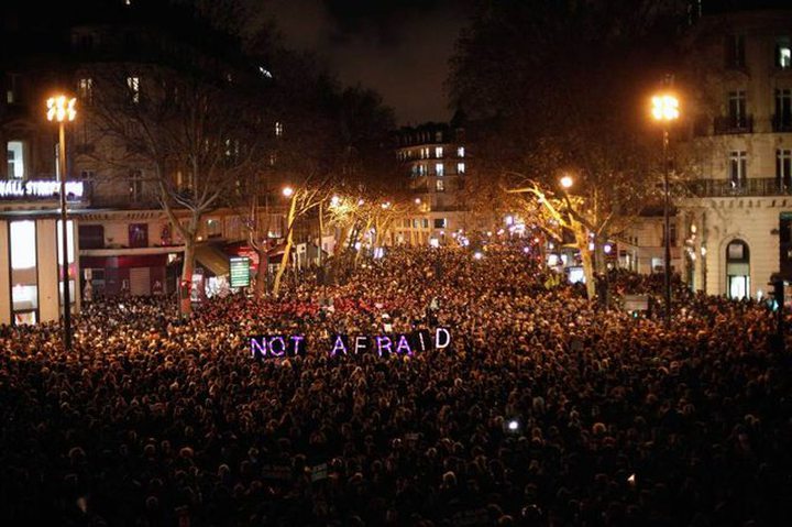 People gather to pay respect for the victims of a terror attack against a satirical newspaper, Paris