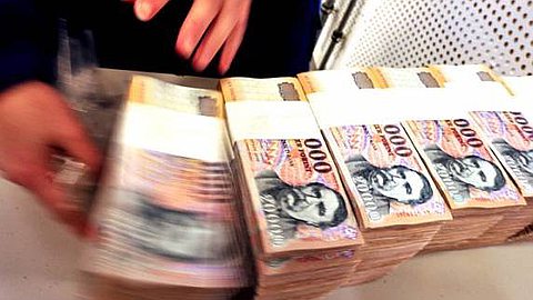 Hungary Burns Banknotes to Warm the Needy