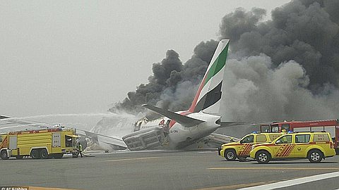 Emirates passenger jet with 300 on board crash lands at Dubai International Airport after catching fire in the air... and explodes on the runway