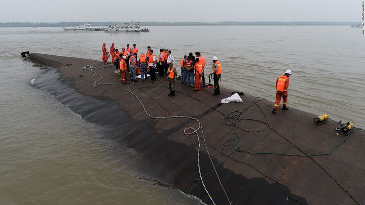 Rescuers work at the site of an overturned passenger ship on the Yangtze River in China on Tuesday, 