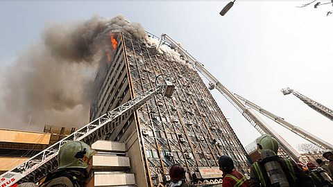 30 Firefighters Feared Dead in Tehran High-Rise Collapse
