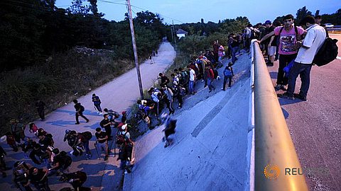 Refugees Break Through Police Lines and March on Hungary Highway