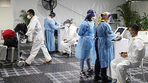 WHO chief scientist urges people not to panic over Omicron