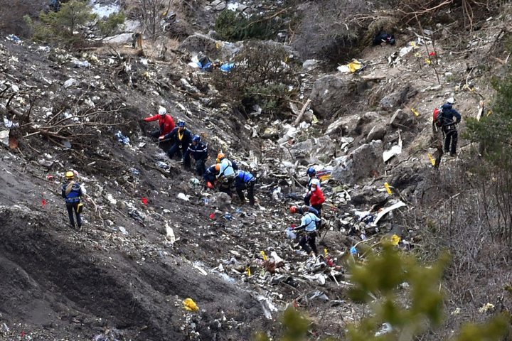 Investigators work through scattered debris near the Germanwings crash site.