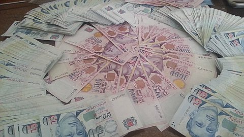 Singapore Surprise Policy Easing Spurs Asia-Wide Currency Rout