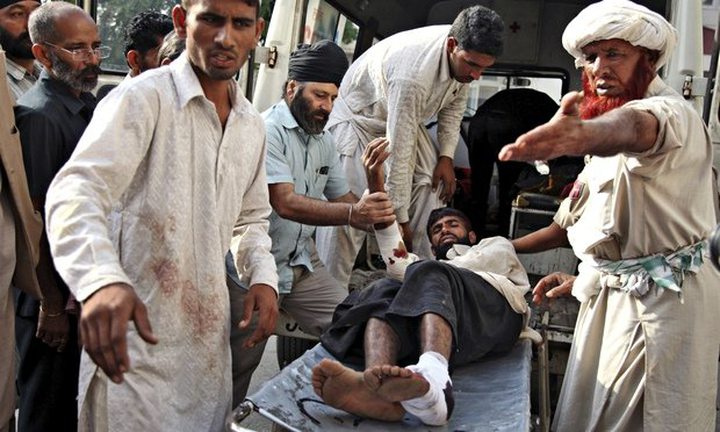 An injured Indian man is brought in for treatment in Jammu following firing by Pakistani troops...