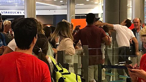Airport worker punches Easyjet passenger holding a baby