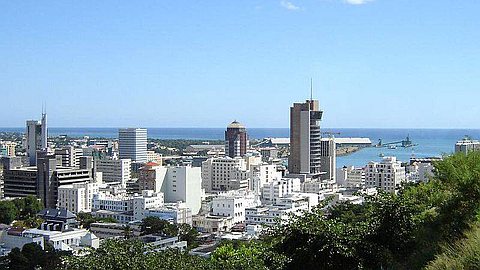 How many South Africans have bought property in Mauritius
