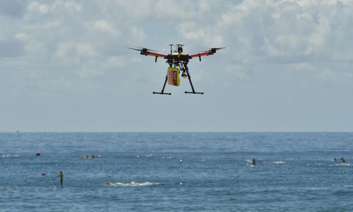 A drone has rescued two people from rough seas...