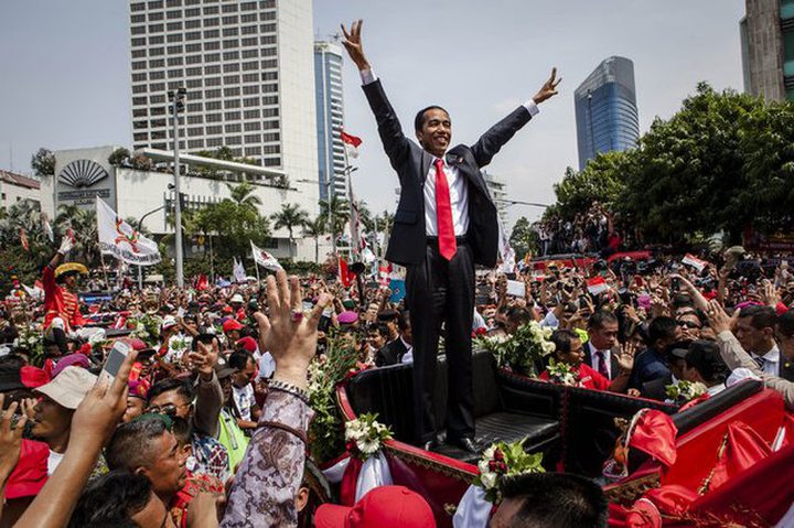 Sworn in Monday as president of Indonesia, Joko Widodo celebrated in an inaugural parade