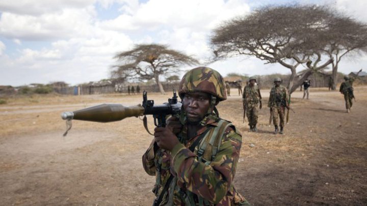 A Kenyan army soldier carries a rocket-propelled grenade launcher as he patrols Tabda, Somalia