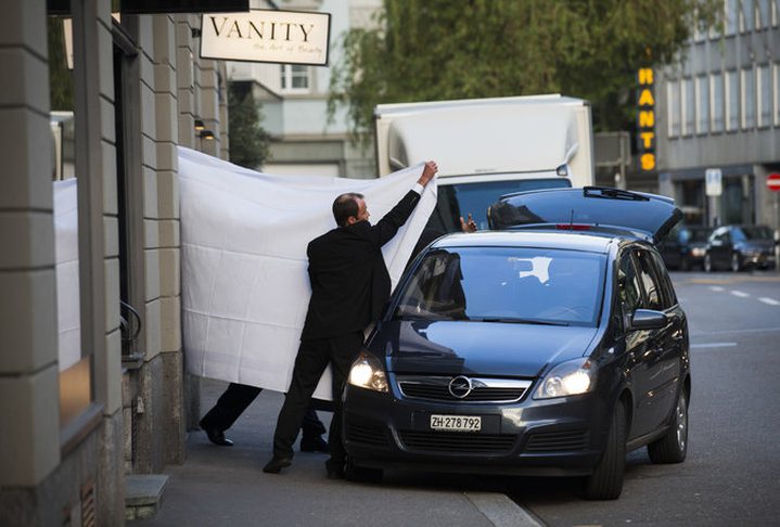 FIFA officials were escorted out behind sheets at the Baur au Lac hotel in Zurich